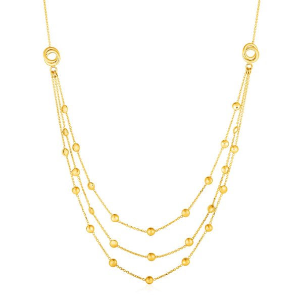 Station Necklace with Three Chains and Love Knots in 14k Yellow Gold